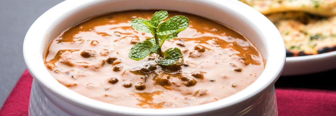 Traditional Indian lamb korma and mango chicken dishes at Tandoori Grill downtown Calgary